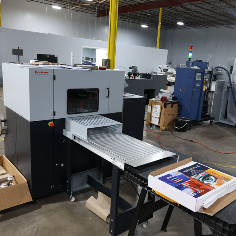 an advanced printing machine creating booklets.